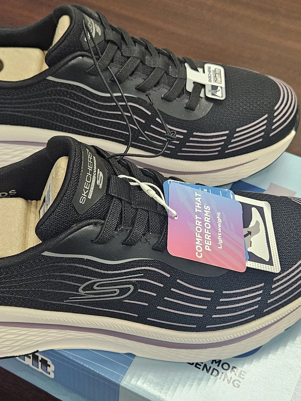 Skechers Women's Black and White Athletic Slip-On Sneakers